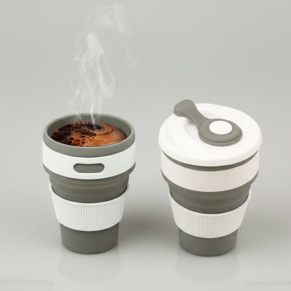 Collapsible coffee cup with steam in an office setting